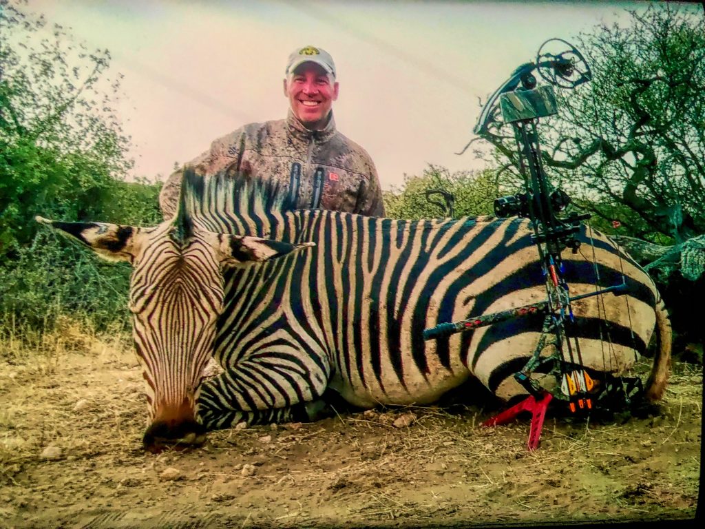 Nambia Plains Game Hunt III - Hunter with Trophy Zebra